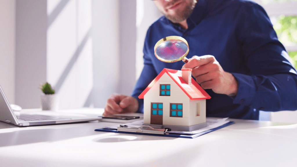 A person looking at a house model