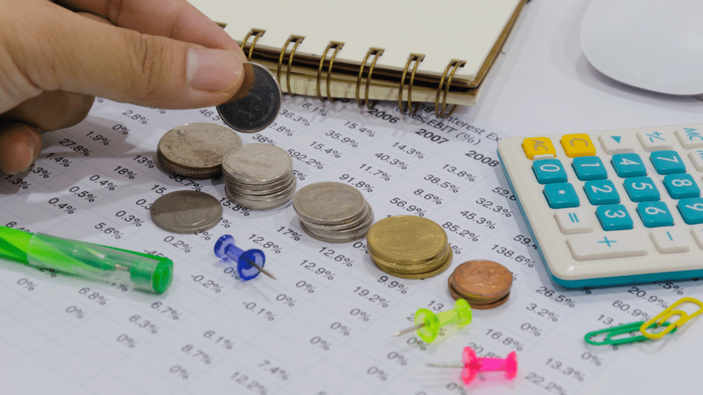 coins and paper at the table