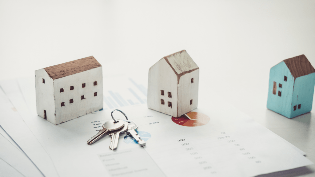 small house models sitting on top of a piece of paper