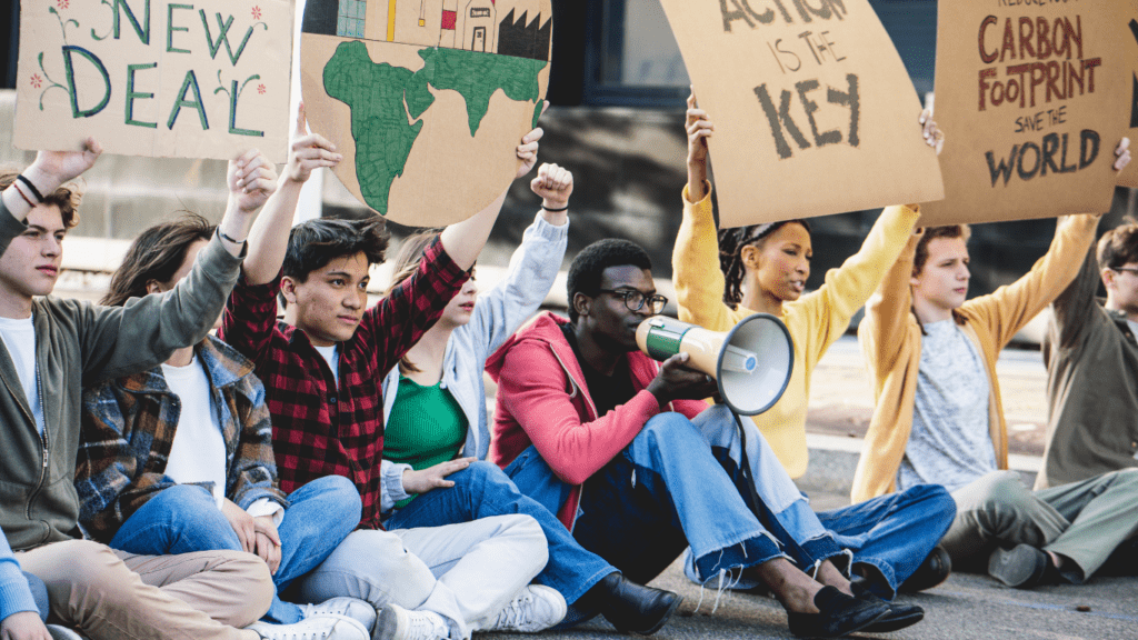 a group of people holding a sign