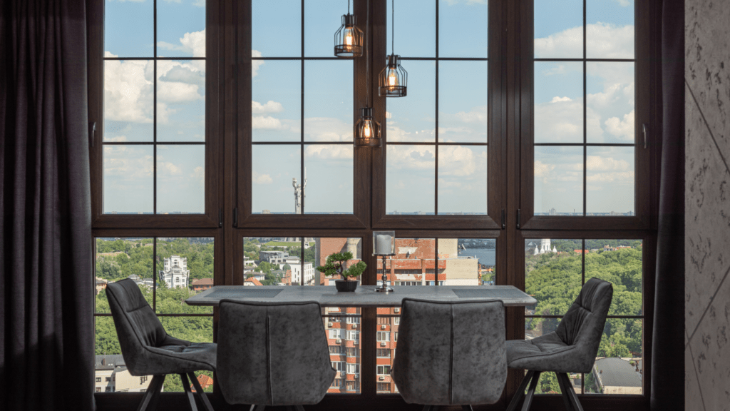 a living room with large windows overlooking the city