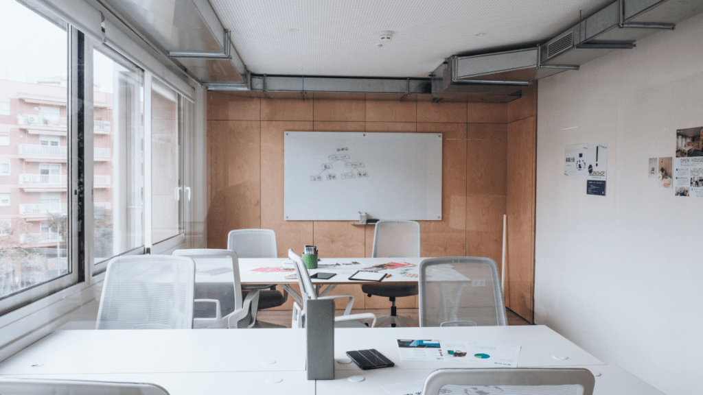 a modern apartment with white walls and wooden floors