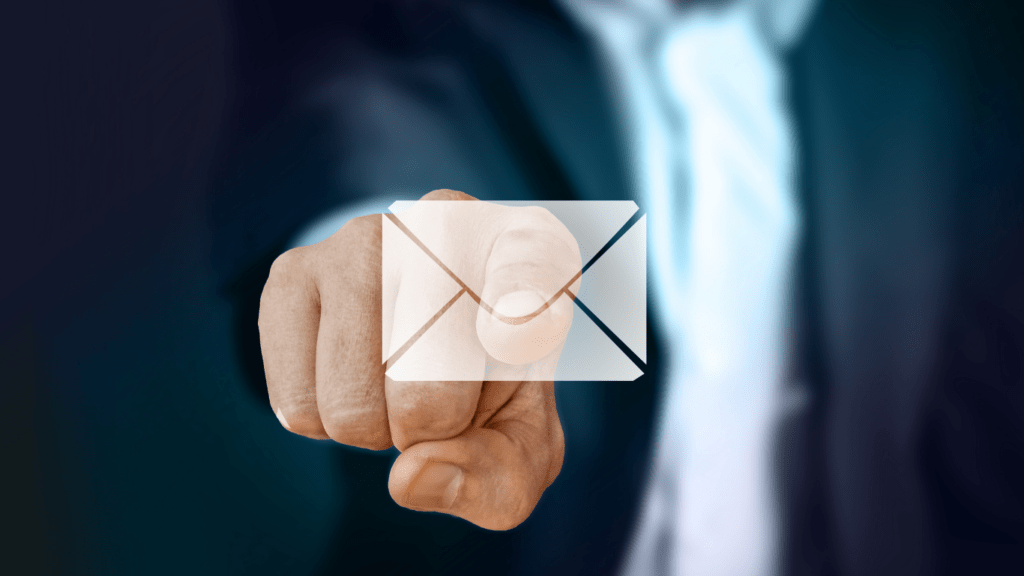 a person holding an envelope with an email icon on it