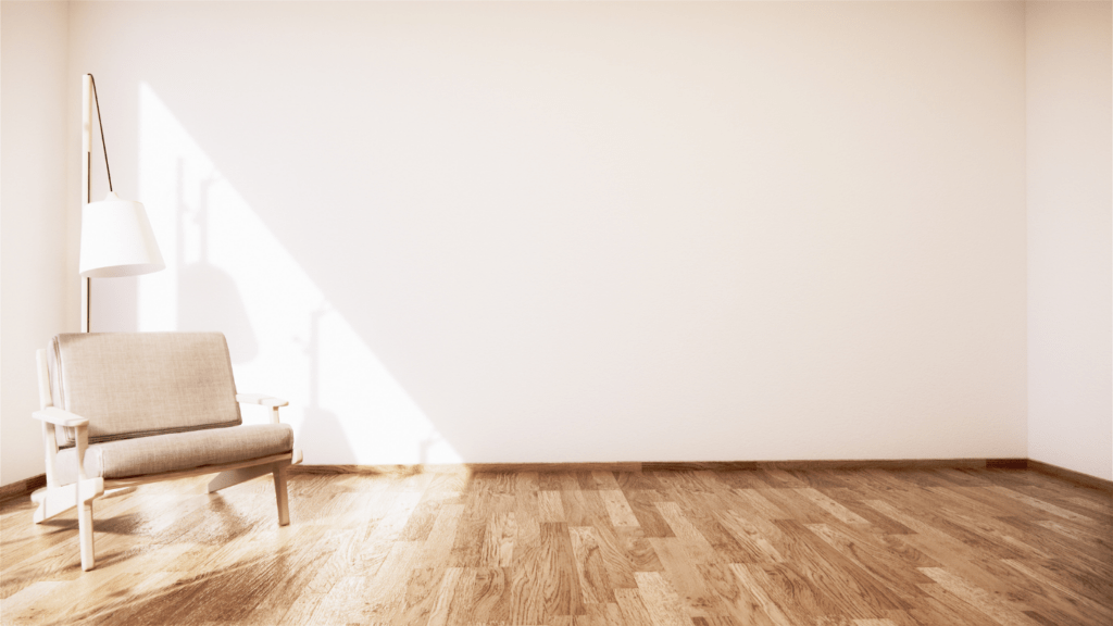 an empty living room with hardwood floors