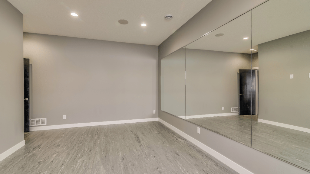 an empty room with white walls and carpeting